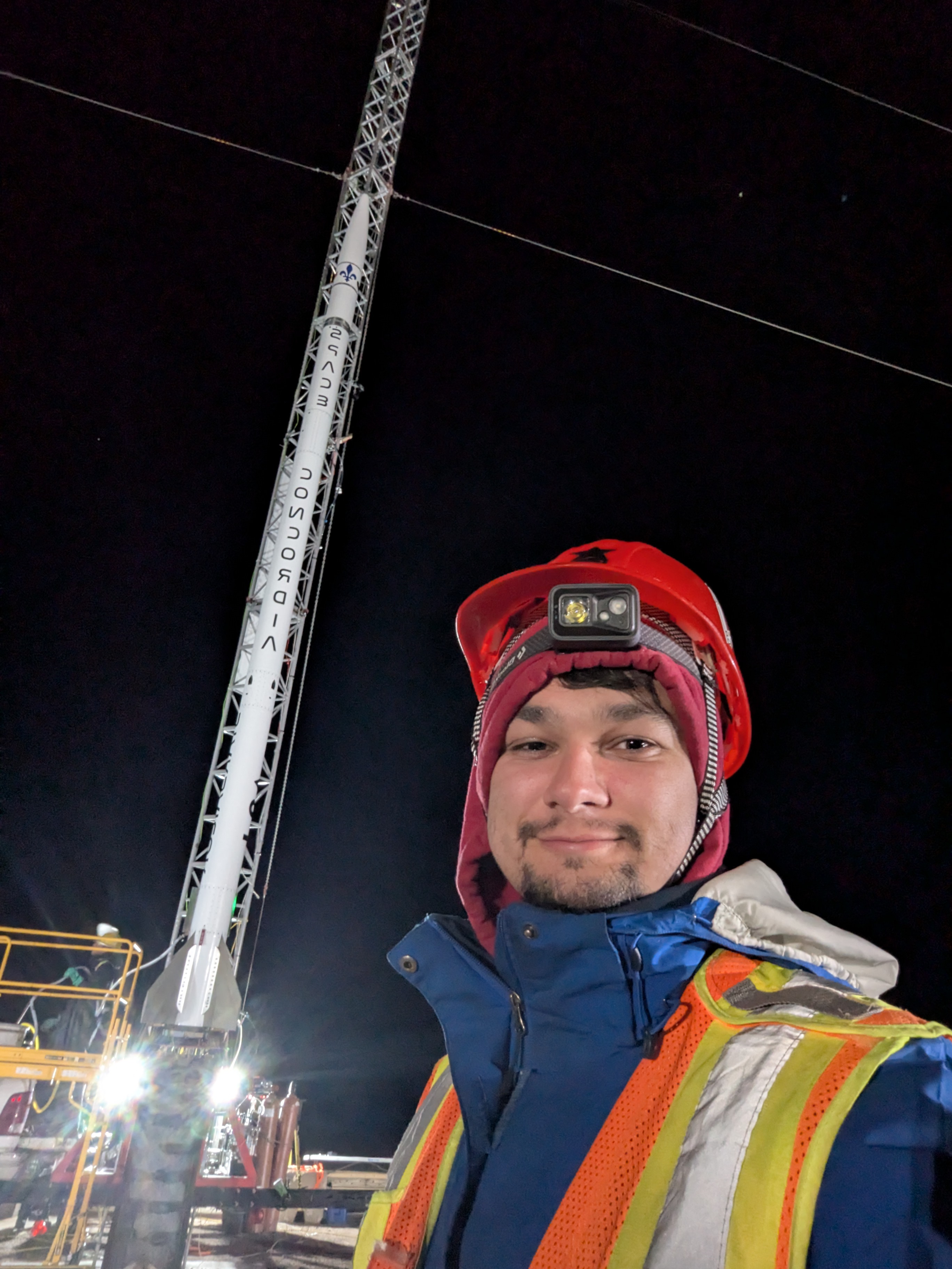 Rafael standing infront of starsailor rocket